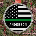 Personalized Thin Green Line A Military Christmas Metal Ornament<br><div class="desc">Thin Green Line Flag Military Ornament, a perfect addition to your Christmas decor! Show your support for the brave men and women who protect our borders, parks, and wildlife. This modern and simple ornament features the American flag with a thin green line representing federal law enforcement officers, border patrol, game...</div>