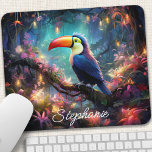 Personalized Toucan Paradise Mouse Pad<br><div class="desc">Escape to a tropical paradise with this personalized mouse pad featuring a vibrant toucan amidst lush jungle foliage. The colorful design and intricate details transport you to an exotic world, inspiring creativity and joy. Add a personal touch with your name or a favorite quote. The smooth surface ensures precise mouse...</div>