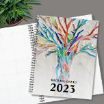Personalized Tree of Life  2023 Planner<br><div class="desc">This unique Planner is decorated with a brightly coloured Tree of Life on a pale gray background. The original design was made in mosaic using tiny pieces of brightly colored glass. Customize it with your name and year. To edit further use the Design Tool to change the font, font size,...</div>