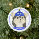 Personalized Tricolor Chihuahua Hanukkah Ceramic Ornament<br><div class="desc">Celebrate your favorite mensch on a bench with personalized ornament! This design features a sweet illustration of a tricolor long haired chihuahua dog with a blue and white yarmulke. For the most thoughtful gifts, pair it with another item from my collection! To see more work and learn about this artist,...</div>