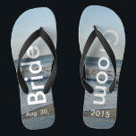 Personalized Wedding Beach Sand Flip Flops<br><div class="desc">Pretty Blue Sky with Light Fluffy White Clouds, Blue Sea, Crashing Ocean Waves and Beach Sand. Unisex Flip Flops with Bride and Groom Date of Marriage written in a white color text. PERSONALIZE with your text on left and right feet, (or delete text to only show image). The wedding date...</div>