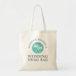 Personalized Wedding Swag Bag Guest Welcome<br><div class="desc">Welcome the bridal party and out-of-town guests to your wedding festivities with a "swag bag" filled with goodies and items to make their stay comfortable and memorable. This whimsical tote bag design is highlighted with a round palm tree logo in aqua and white. The bride and grooms names curve around...</div>