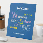 Personalized WELCOME LOVE JOY PEACE Jewish Pedestal Sign<br><div class="desc">Give your home a welcoming edge with this personalized Hebrew Welcome Pedestal Sign in tekhelet blue with CUSTOMIZABLE TEXT. The placeholder text is customizable, so you can change the heading and add your family name. The words LOVE JOY PEACE are also written in Hebrew (and color coded). Suitable for Hanukkah,...</div>