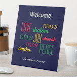 Personalized WELCOME LOVE JOY PEACE Jewish Pedestal Sign<br><div class="desc">Give your home a welcoming edge with this personalized Hebrew Welcome Pedestal Sign with CUSTOMIZABLE TEXT. The placeholder text is customizable, so you can change the heading and add your family name. The words LOVE JOY PEACE are also written in Hebrew (and color coded). Suitable for Hanukkah, Weddings, Corporate Events,...</div>