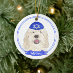 Personalized White Cream Doodle Dog Hanukkah Ceramic Ornament<br><div class="desc">Celebrate your favorite mensch on a bench with personalized ornament! This design features a sweet illustration of a white or cream doodle dog with a blue and white yarmulke. For the most thoughtful gifts, pair it with another item from my collection! To see more work and learn about this artist,...</div>