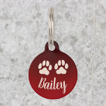 Pet Paws with Custom Name Bailey Dark Red Pet ID Tag<br><div class="desc">Ensure the safety and style of your beloved pet with our elegantly personalized pet ID tag. This round tag features a striking dark red color, adorned with two adorable paw prints, symbolizing the love and companionship shared with your furry friend. The sample name "Bailey" demonstrates the customizable nature of this...</div>