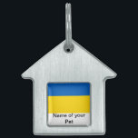 Pet Tag with Flag of Ukraine<br><div class="desc">Add a touch of Ukrainian pride to your pet's accessories with our exclusive pet tag featuring the flag of Ukraine! Crafted with meticulous attention to detail, this pet tag is not just a functional item; it’s a celebration of Ukrainian heritage and cultural pride. The vibrant design prominently displays the iconic...</div>