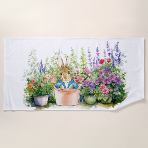 Peter the rabbit in his flower garden beach towel