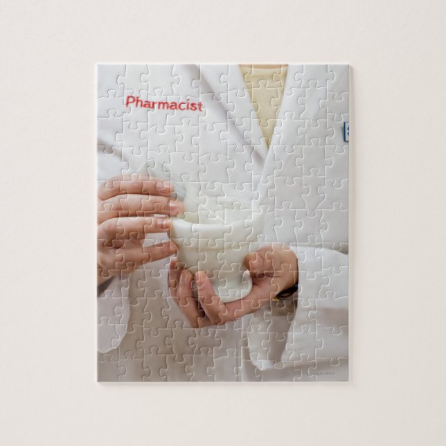 Pharmacist holding mortar and pestle jigsaw puzzle (Vertical)