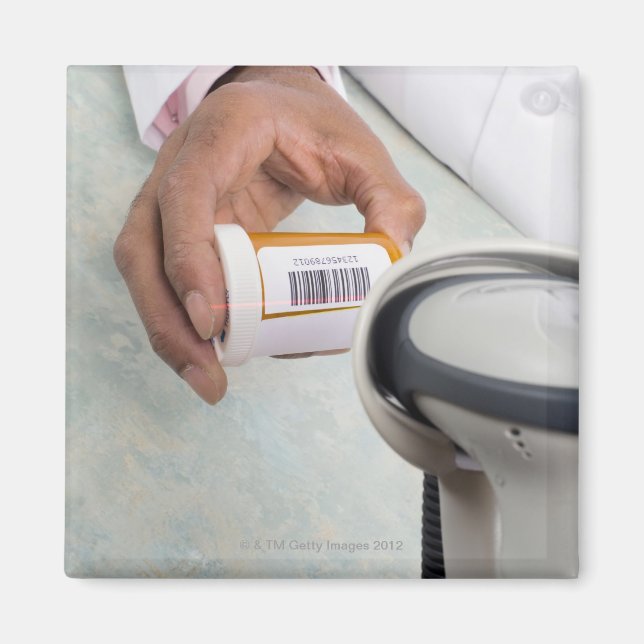 Pharmacist scanning pill bottle with a barcode magnet (Front)