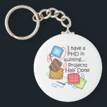 PHD In Quilting Keychain<br><div class="desc">Quilting is such a special talent that requires time patience. Give this quilting bug design to them. They will love it!</div>