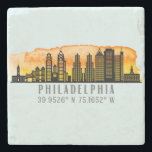 Philadelphia Skyline Map Coordinates  Stone Coaster<br><div class="desc">Stylish and modern stone coaster features Philadelphia Pennsylvania city skyline silhouette with sunset watercolor splash background and latitude & longitude map coordinates on pale blue background. Great for your own home or as a Philly keepsake for others.</div>