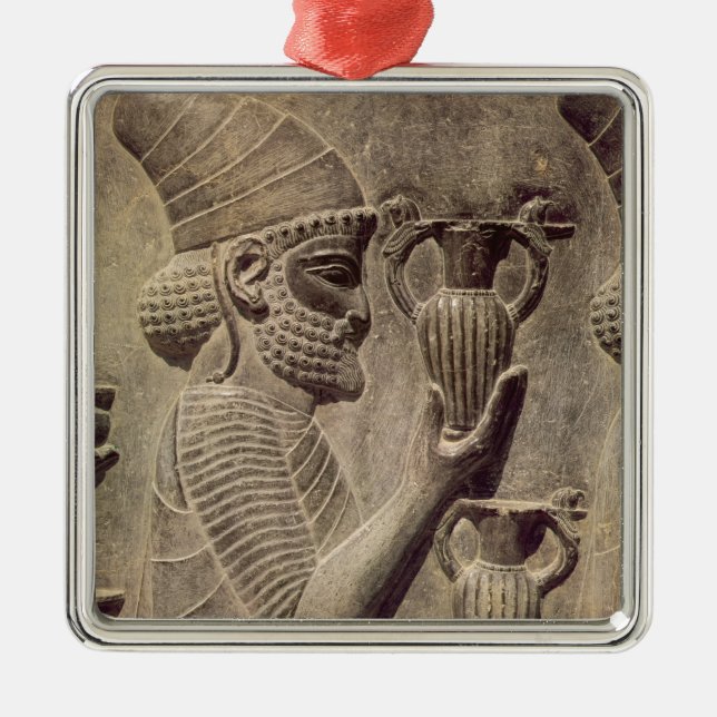 Phoenician carrying two offering, detail relief metal ornament (Front)
