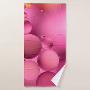 photo, bright oily drops in water with colorful ba bath towel
