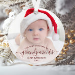 Photo Grandparents First Christmas Red Script Ornament<br><div class="desc">Help them celebrate their first grandchild with this beautiful modern keepsake ornament. The burgundy red text reads "Our first Christmas as grandparents, " with the word "grandparents" in elegant handwriting script with flourishes before and after. Easily replace the sample image with your favorite photo of the new baby, and add...</div>