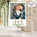 Photo Greenery Gold Wedding Table Number Sign<br><div class="desc">Modern botanical greenery wedding reception table number sign featuring one or two photos of the couple (engagement photos or dating pictures through the years) for entertaining wedding guests as well as identifying tables. Duplicated on both sides for two-sided viewing. CHANGES: The gold and black text colors can be changed to...</div>