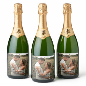 Photo Modern Script We're Engaged Engagement Party Sparkling Wine Label