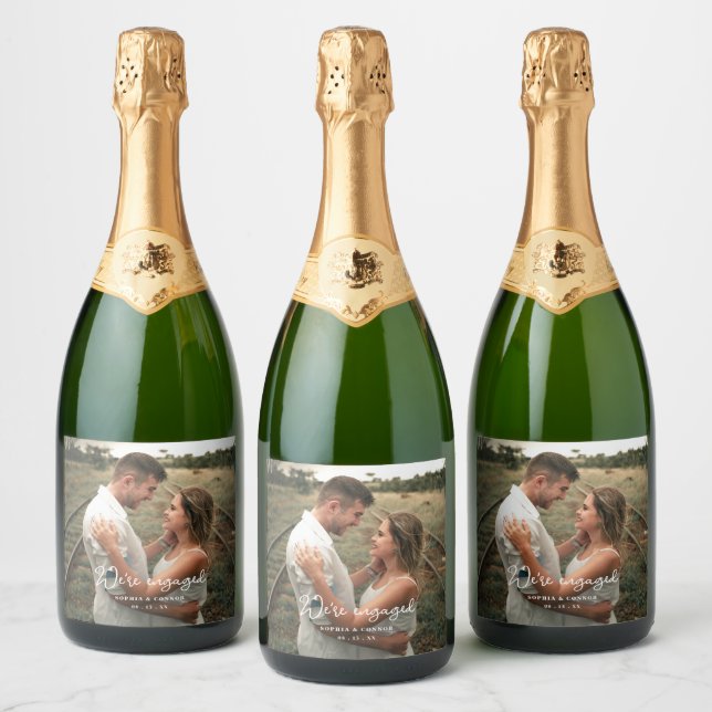 Photo Modern Script We're Engaged Engagement Party Sparkling Wine Label (Bottles)