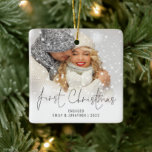 Photo Name Year First Christmas Engaged Ceramic Ornament<br><div class="desc">Photo Overlay Names Year First Christmas Engaged. To celebrate your first holiday engaged easily personalize your names and year. With an elegant set script for First Christmas. Choose your favorite photo to replace the sample picture. Changes to colors of text can be made to better suit your photo if necessary...</div>