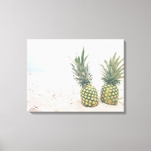 Photo of 2 Pineapples on a Beach Canvas Print