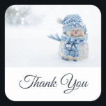 Photo of a Cute Snowman in Winter Thank You Square Sticker<br><div class="desc">Thank you stickers with a cute photograph of a little snowman. Standing outside in the winter with snow falling all around. This cute little guy is dressed up in blue knitted hat and scarf.</div>