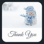 Photo of a Cute Snowman in Winter Thank You Square Sticker<br><div class="desc">Thank you stickers with a cute photograph of a little snowman. Standing outside in the winter with snow falling all around. This cute little guy is dressed up in blue knitted hat and scarf.</div>