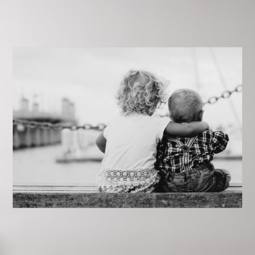 Photo of toddler sister hugging her baby brother poster