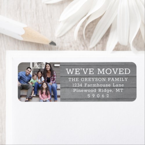 Photo We've Moved Rustic Grey Wood Return Address Label - Add a stylish finishing touch to moving announcement envelopes with these custom photo We've Moved / I've Moved return address labels. Text and picture are simple to customize. Modern farmhouse style design features gray rustic faux wood background, one image of your choice, elegant handwriting script calligraphy and minimalist typography. These labels are a chic modern way to introduce family and friends to your new home. Perfect for change of address cards and housewarming invitations.