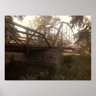 Photograph of an old, rusty iron truss bridge  poster