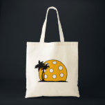 Pickleball Beach Sunset Tote Bag<br><div class="desc">This fun item for the pickleball lover in your life is sure to delight.  With the pickle ball going down on the island beach with the palm trees.  You will make them smile as they dink to win in their next game or tournament.</div>
