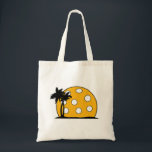 Pickleball Beach Sunset Tote Bag<br><div class="desc">This fun item for the pickleball lover in your life is sure to delight.  With the pickle ball going down on the island beach with the palm trees.  You will make them smile as they dink to win in their next game or tournament.</div>