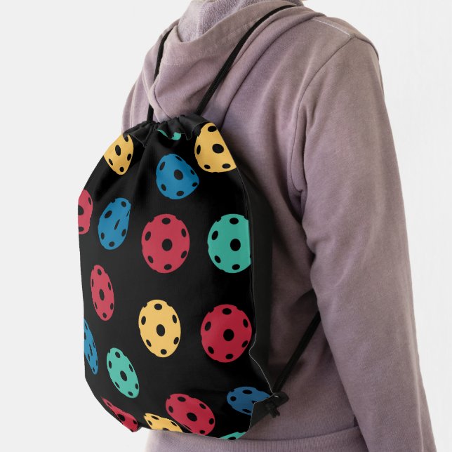 Pickleball - mix of colours on black drawstring bag (Insitu)