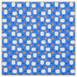 Pickleball Paddles with Orange Pickleball Balls on Fabric
