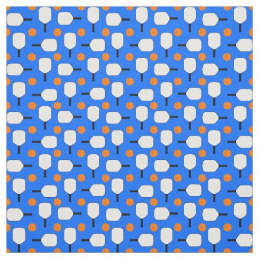 Pickleball Paddles with Orange Pickleball Balls on Fabric