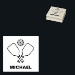 Pickleball with Paddles & Ball Personalized Name Rubber Stamp<br><div class="desc">The Pickleball with Paddles & Ball Personalized Name rubber stamp is a custom stamp that allows users to personalize their belongings with their name. The stamp features a design of a pickleball with paddles and a ball, making it perfect for those who are passionate about the sport. The rubber stamp...</div>