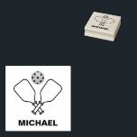 Pickleball with Paddles & Ball Personalized Name Rubber Stamp<br><div class="desc">The Pickleball with Paddles & Ball Personalized Name rubber stamp is a custom stamp that allows users to personalize their belongings with their name. The stamp features a design of a pickleball with paddles and a ball, making it perfect for those who are passionate about the sport. The rubber stamp...</div>