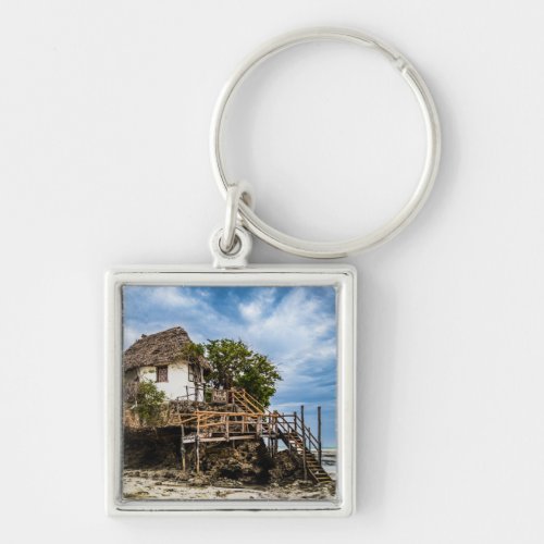 Picturesque house on a tropical coral outcrop keychain