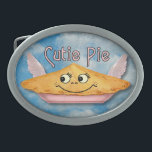 Pie in the Sky Retro Winged Cutie Belt Buckle<br><div class="desc">This cute belt buckle shows a pie in the sky on a blue cloudy sky background with a grunge effect added to make it look antique, alongside the words "Cutie Pie" in a retro style. The pie has a smiling face and light pink wings. It's made up of elements from...</div>