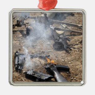 Pieces of enemy weapons lay out to cool off metal ornament