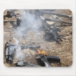 Pieces of enemy weapons lay out to cool off mouse pad