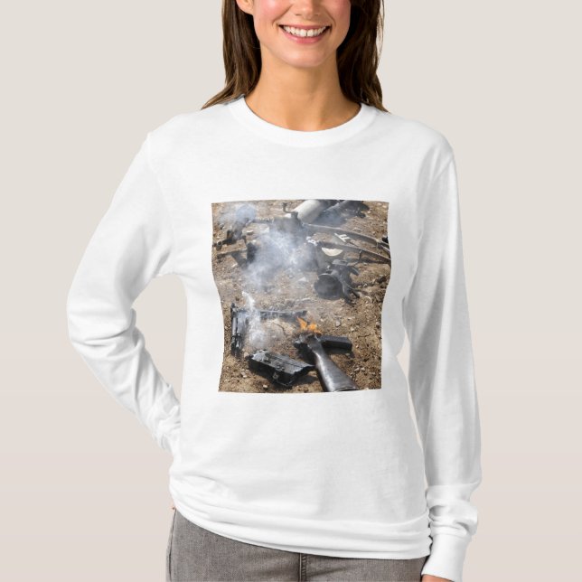 Pieces of enemy weapons lay out to cool off T-Shirt (Front)