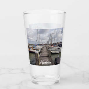 Pier with boats and yachts in Marken Netherlands Glass