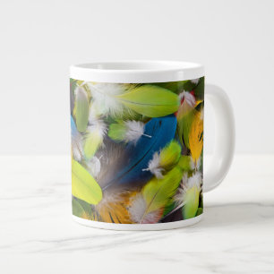 Pile of colorful feathers giant coffee mug