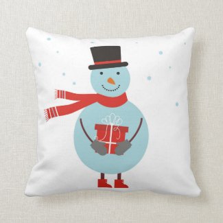 Pillow with red polka dots and snowman.