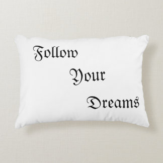Pillows with wording "Follow Your Dreams"