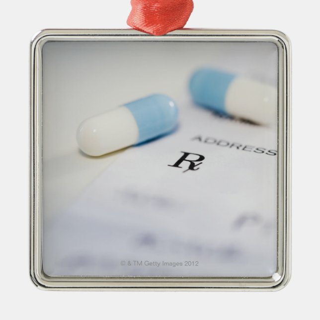 Pills on written prescription metal ornament (Front)