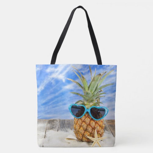 pineapple in sunglasses with starfish tote bag