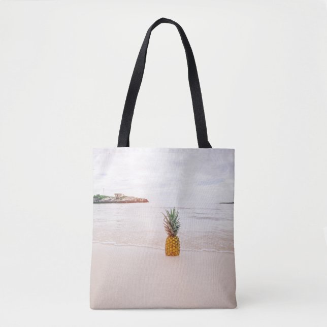 Pineapple on sand near beach tote bag (Front)