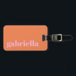 Pink and Orange Bold Typography Personalized Name  Luggage Tag<br><div class="desc">Travel in style with this personalized luggage tag featuring a modern minimalist design. The pink elegant serif name stands out against a soft orange background, creating a chic and timeless look. Perfect for frequent travelers, business professionals, students, and vacationers who want to easily identify their bags. The back includes space...</div>