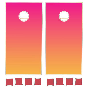 Pink and orange gradient cornhole set
